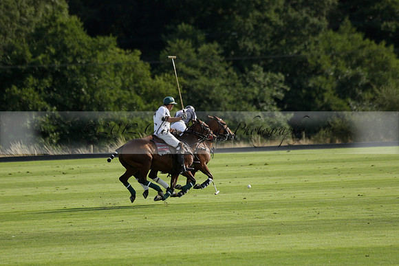 Pandas (white) v Home Farm (navy) in a Park House West Sussex Cup Polo match on Brooksfield at Cowdray Park Polo Club on Friday 30 August 2013. 2013.08.30 www.polopictures.co.uk