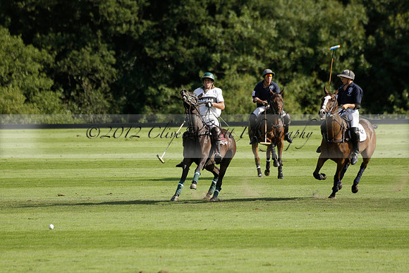 Pandas (white) v Home Farm (navy) in a Park House West Sussex Cup Polo match on Brooksfield at Cowdray Park Polo Club on Friday 30 August 2013. 2013.08.30 www.polopictures.co.uk
