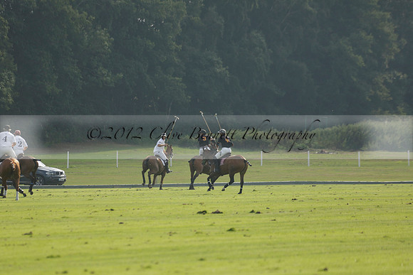 Pluma Negra (white) v Shoreline (black) in the Brecknock Cup Subsidiary final polo match played on Sunday 25 August 2013 at Cowdray Park Polo Club on Ambersham 1. 2013.10.12 www.polopictures.co.uk