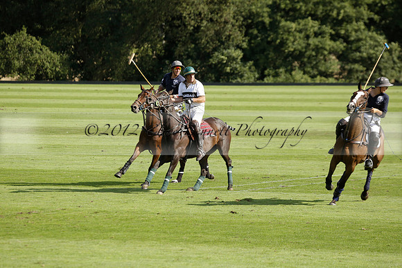 Pandas (white) v Home Farm (navy) in a Park House West Sussex Cup Polo match on Brooksfield at Cowdray Park Polo Club on Friday 30 August 2013. 2013.08.30 www.polopictures.co.uk