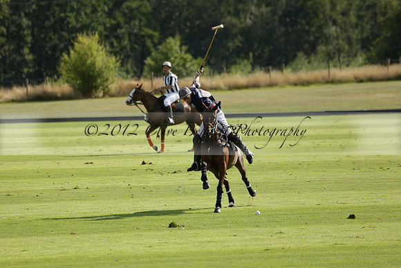 Pandas (white) v Home Farm (navy) in a Park House West Sussex Cup Polo match on Brooksfield at Cowdray Park Polo Club on Friday 30 August 2013. 2013.08.30 www.polopictures.co.uk