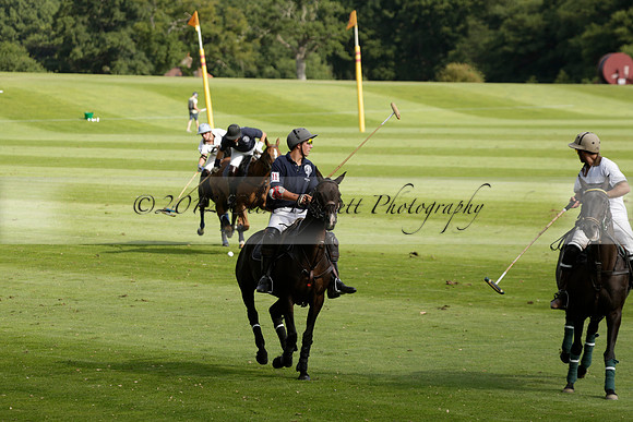 Pandas (white) v Home Farm (navy) in a Park House West Sussex Cup Polo match on Brooksfield at Cowdray Park Polo Club on Friday 30 August 2013. 2013.08.30 www.polopictures.co.uk