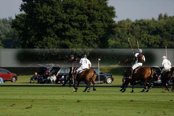 Pluma Negra (white) v Shoreline (black) in the Brecknock Cup Subsidiary final polo match played on Sunday 25 August 2013 at Cowdray Park Polo Club on Ambersham 1. 2013.10.12 www.polopictures.co.uk