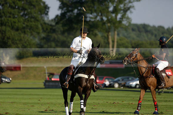 Pluma Negra (white) v Shoreline (black) in the Brecknock Cup Subsidiary final polo match played on Sunday 25 August 2013 at Cowdray Park Polo Club on Ambersham 1. 2013.10.12 www.polopictures.co.uk