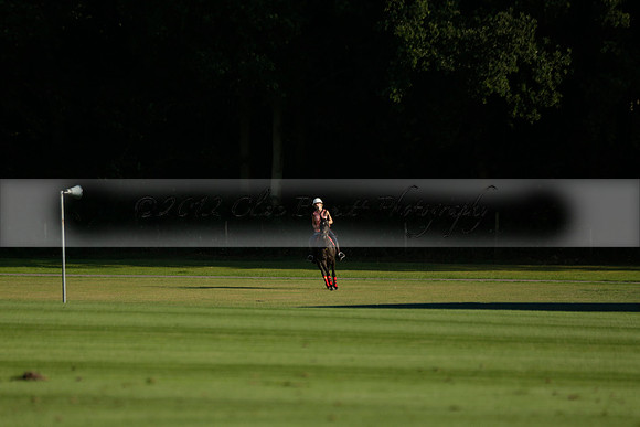 Pluma Negra (white) v Shoreline (black) in the Brecknock Cup Subsidiary final polo match played on Sunday 25 August 2013 at Cowdray Park Polo Club on Ambersham 1. 2013.10.12 www.polopictures.co.uk