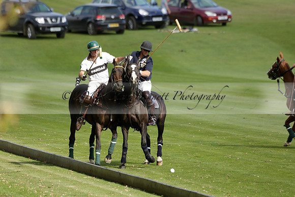Pandas (white) v Home Farm (navy) in a Park House West Sussex Cup Polo match on Brooksfield at Cowdray Park Polo Club on Friday 30 August 2013. 2013.08.30 www.polopictures.co.uk