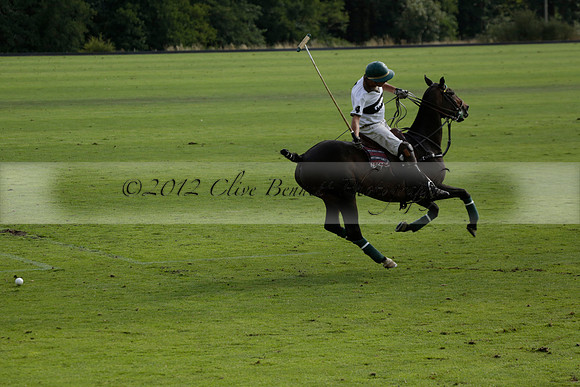 Pandas (white) v Home Farm (navy) in a Park House West Sussex Cup Polo match on Brooksfield at Cowdray Park Polo Club on Friday 30 August 2013. 2013.08.30 www.polopictures.co.uk
