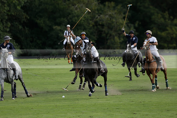 Pandas (white) v Home Farm (navy) in a Park House West Sussex Cup Polo match on Brooksfield at Cowdray Park Polo Club on Friday 30 August 2013. 2013.08.30 www.polopictures.co.uk