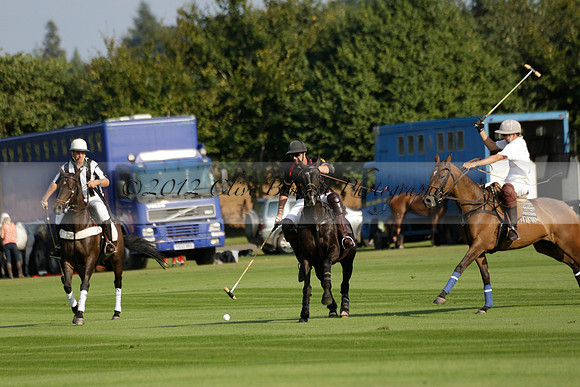 Pluma Negra (white) v Shoreline (black) in the Brecknock Cup Subsidiary final polo match played on Sunday 25 August 2013 at Cowdray Park Polo Club on Ambersham 1. 2013.10.12 www.polopictures.co.uk