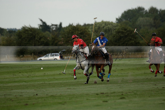 Ghost Chilli (blue) v Team Tonic (red) in a Lodsworth Cup Polo match on Ambersham 3 at Cowdray Park Polo Club on Friday 30 August 2013. 2013.08.30 www.polopictures.co.uk