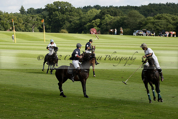 Pandas (white) v Home Farm (navy) in a Park House West Sussex Cup Polo match on Brooksfield at Cowdray Park Polo Club on Friday 30 August 2013. 2013.08.30 www.polopictures.co.uk