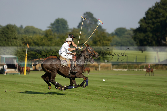 Pluma Negra (white) v Shoreline (black) in the Brecknock Cup Subsidiary final polo match played on Sunday 25 August 2013 at Cowdray Park Polo Club on Ambersham 1. 2013.10.12 www.polopictures.co.uk