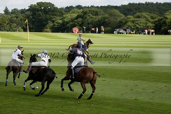 Pandas (white) v Home Farm (navy) in a Park House West Sussex Cup Polo match on Brooksfield at Cowdray Park Polo Club on Friday 30 August 2013. 2013.08.30 www.polopictures.co.uk