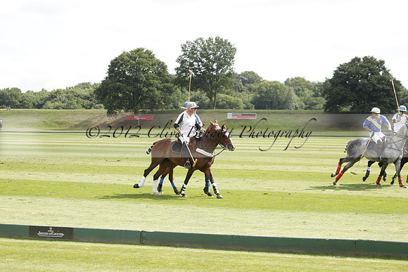 Ghost Chilli (blue) v Team Tonic (red) in a Lodsworth Cup Polo match on Ambersham 3 at Cowdray Park Polo Club on Friday 30 August 2013. 2013.08.30 www.polopictures.co.uk