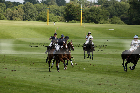 Pandas (white) v Home Farm (navy) in a Park House West Sussex Cup Polo match on Brooksfield at Cowdray Park Polo Club on Friday 30 August 2013. 2013.08.30 www.polopictures.co.uk