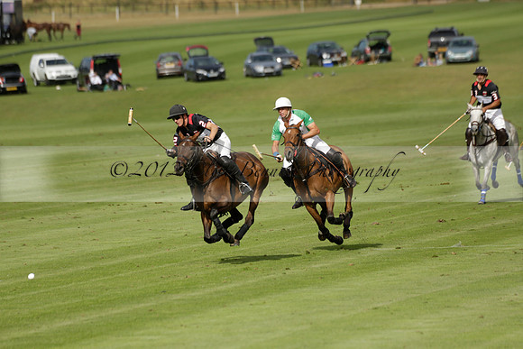 Jaeger Le Coultre (black)  v Wairakei Pastoral (white) in a Jaeger Le Coultre Holden White Cup polo match played on 29 July 2013 at Cowdray Park Polo Club on Brooksfieldwww.polopictures.co.uk