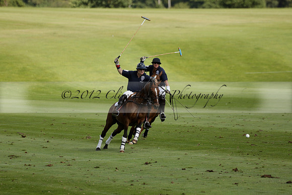 Pandas (white) v Home Farm (navy) in a Park House West Sussex Cup Polo match on Brooksfield at Cowdray Park Polo Club on Friday 30 August 2013. 2013.08.30 www.polopictures.co.uk