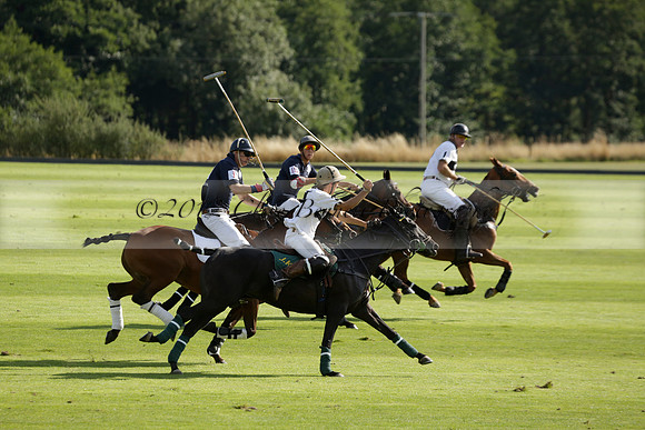 Pandas (white) v Home Farm (navy) in a Park House West Sussex Cup Polo match on Brooksfield at Cowdray Park Polo Club on Friday 30 August 2013. 2013.08.30 www.polopictures.co.uk
