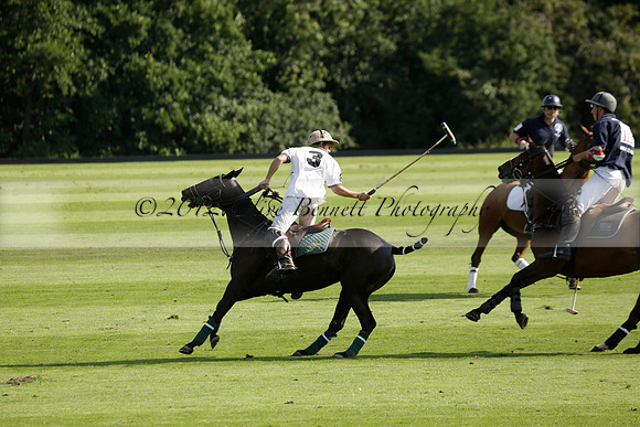 Pandas (white) v Home Farm (navy) in a Park House West Sussex Cup Polo match on Brooksfield at Cowdray Park Polo Club on Friday 30 August 2013. 2013.08.30 www.polopictures.co.uk