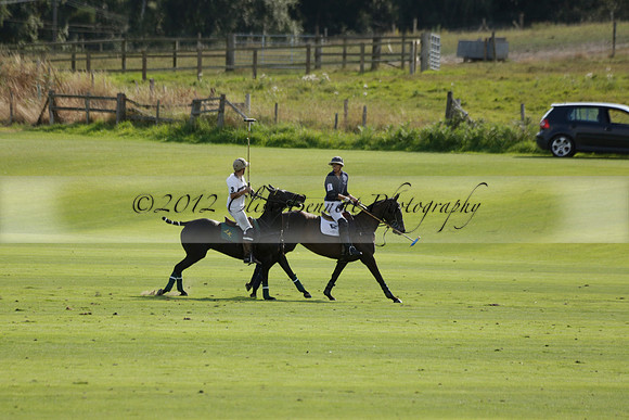 Pandas (white) v Home Farm (navy) in a Park House West Sussex Cup Polo match on Brooksfield at Cowdray Park Polo Club on Friday 30 August 2013. 2013.08.30 www.polopictures.co.uk
