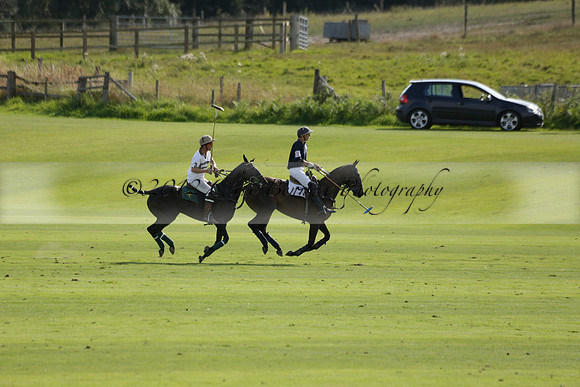 Pandas (white) v Home Farm (navy) in a Park House West Sussex Cup Polo match on Brooksfield at Cowdray Park Polo Club on Friday 30 August 2013. 2013.08.30 www.polopictures.co.uk