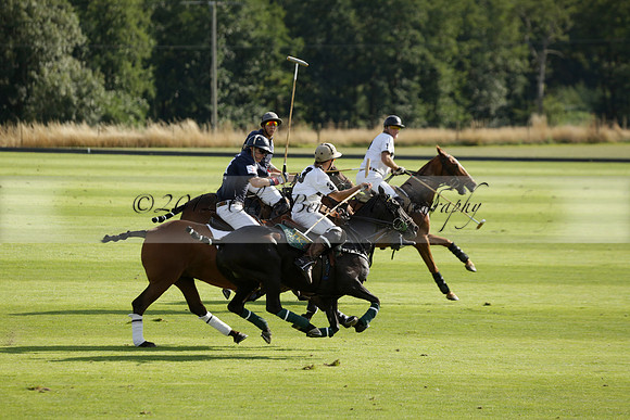 Pandas (white) v Home Farm (navy) in a Park House West Sussex Cup Polo match on Brooksfield at Cowdray Park Polo Club on Friday 30 August 2013. 2013.08.30 www.polopictures.co.uk