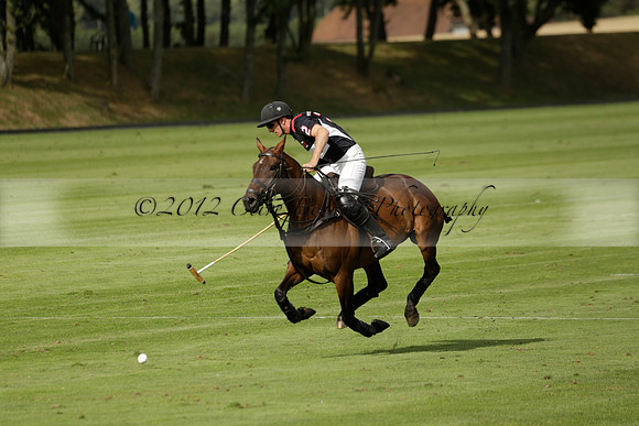 Jaeger Le Coultre (black)  v Wairakei Pastoral (white) in a Jaeger Le Coultre Holden White Cup polo match played on 29 July 2013 at Cowdray Park Polo Club on Brooksfieldwww.polopictures.co.uk