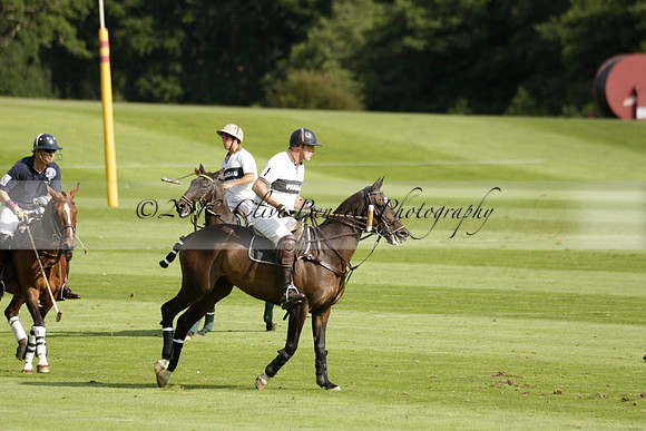 Pandas (white) v Home Farm (navy) in a Park House West Sussex Cup Polo match on Brooksfield at Cowdray Park Polo Club on Friday 30 August 2013. 2013.08.30 www.polopictures.co.uk