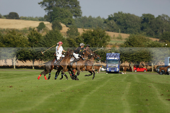 Pluma Negra (white) v Shoreline (black) in the Brecknock Cup Subsidiary final polo match played on Sunday 25 August 2013 at Cowdray Park Polo Club on Ambersham 1. 2013.10.12 www.polopictures.co.uk