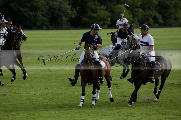 Pandas (white) v Home Farm (navy) in a Park House West Sussex Cup Polo match on Brooksfield at Cowdray Park Polo Club on Friday 30 August 2013. 2013.08.30 www.polopictures.co.uk