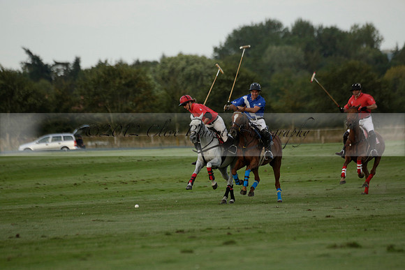Ghost Chilli (blue) v Team Tonic (red) in a Lodsworth Cup Polo match on Ambersham 3 at Cowdray Park Polo Club on Friday 30 August 2013. 2013.08.30 www.polopictures.co.uk