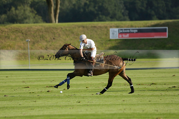 Pluma Negra (white) v Shoreline (black) in the Brecknock Cup Subsidiary final polo match played on Sunday 25 August 2013 at Cowdray Park Polo Club on Ambersham 1. 2013.10.12 www.polopictures.co.uk
