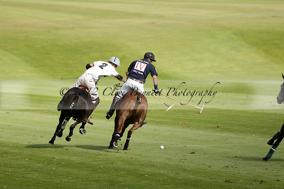 Pandas (white) v Home Farm (navy) in a Park House West Sussex Cup Polo match on Brooksfield at Cowdray Park Polo Club on Friday 30 August 2013. 2013.08.30 www.polopictures.co.uk