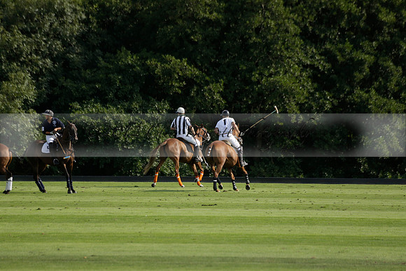 Pandas (white) v Home Farm (navy) in a Park House West Sussex Cup Polo match on Brooksfield at Cowdray Park Polo Club on Friday 30 August 2013. 2013.08.30 www.polopictures.co.uk
