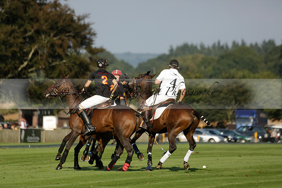 Pluma Negra (white) v Shoreline (black) in the Brecknock Cup Subsidiary final polo match played on Sunday 25 August 2013 at Cowdray Park Polo Club on Ambersham 1. 2013.10.12 www.polopictures.co.uk