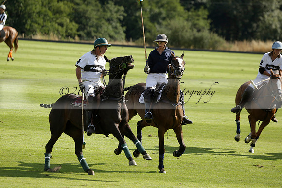 Pandas (white) v Home Farm (navy) in a Park House West Sussex Cup Polo match on Brooksfield at Cowdray Park Polo Club on Friday 30 August 2013. 2013.08.30 www.polopictures.co.uk