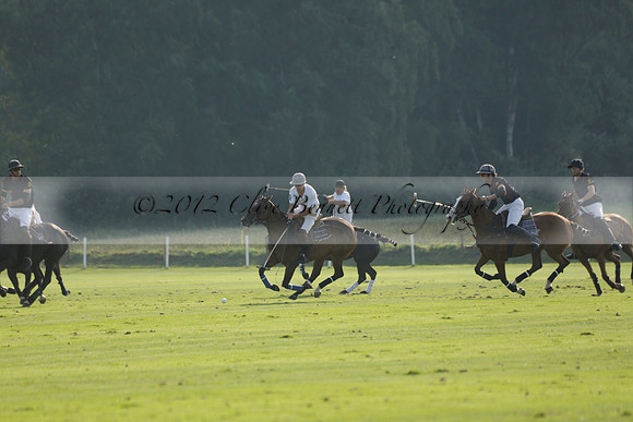 Pluma Negra (white) v Shoreline (black) in the Brecknock Cup Subsidiary final polo match played on Sunday 25 August 2013 at Cowdray Park Polo Club on Ambersham 1. 2013.10.12 www.polopictures.co.uk
