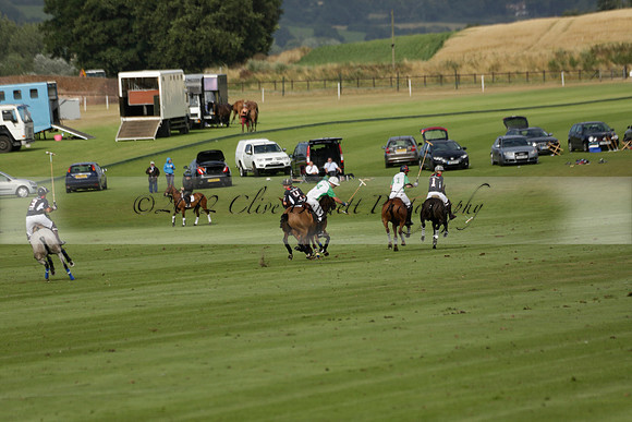 Jaeger Le Coultre (black)  v Wairakei Pastoral (white) in a Jaeger Le Coultre Holden White Cup polo match played on 29 July 2013 at Cowdray Park Polo Club on Brooksfieldwww.polopictures.co.uk