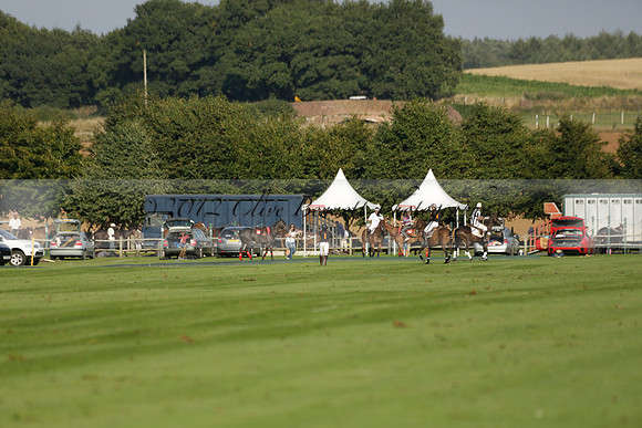 Pluma Negra (white) v Shoreline (black) in the Brecknock Cup Subsidiary final polo match played on Sunday 25 August 2013 at Cowdray Park Polo Club on Ambersham 1. 2013.10.12 www.polopictures.co.uk