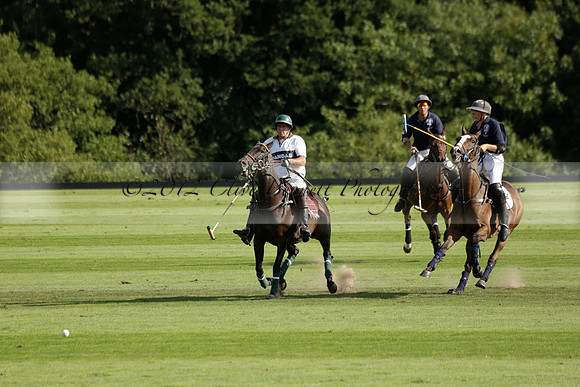 Pandas (white) v Home Farm (navy) in a Park House West Sussex Cup Polo match on Brooksfield at Cowdray Park Polo Club on Friday 30 August 2013. 2013.08.30 www.polopictures.co.uk
