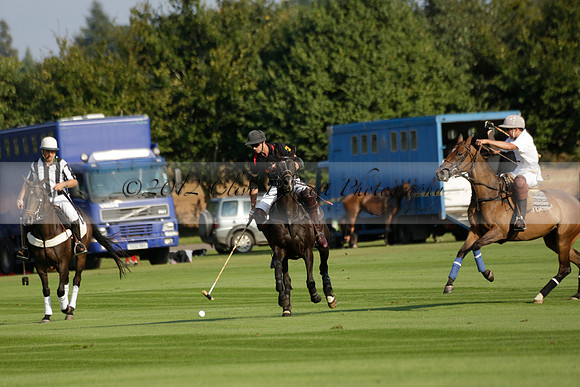 Pluma Negra (white) v Shoreline (black) in the Brecknock Cup Subsidiary final polo match played on Sunday 25 August 2013 at Cowdray Park Polo Club on Ambersham 1. 2013.10.12 www.polopictures.co.uk