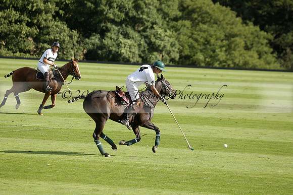 Pandas (white) v Home Farm (navy) in a Park House West Sussex Cup Polo match on Brooksfield at Cowdray Park Polo Club on Friday 30 August 2013. 2013.08.30 www.polopictures.co.uk