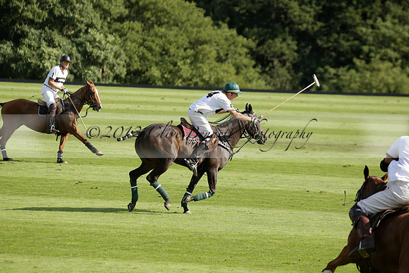 Pandas (white) v Home Farm (navy) in a Park House West Sussex Cup Polo match on Brooksfield at Cowdray Park Polo Club on Friday 30 August 2013. 2013.08.30 www.polopictures.co.uk