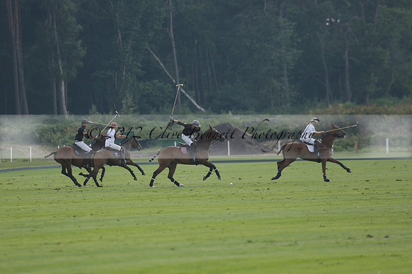 Pluma Negra (white) v Shoreline (black) in the Brecknock Cup Subsidiary final polo match played on Sunday 25 August 2013 at Cowdray Park Polo Club on Ambersham 1. 2013.10.12 www.polopictures.co.uk
