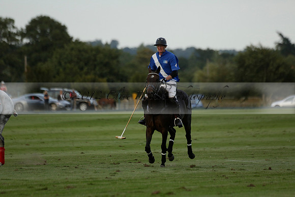 Ghost Chilli (blue) v Team Tonic (red) in a Lodsworth Cup Polo match on Ambersham 3 at Cowdray Park Polo Club on Friday 30 August 2013. 2013.08.30 www.polopictures.co.uk