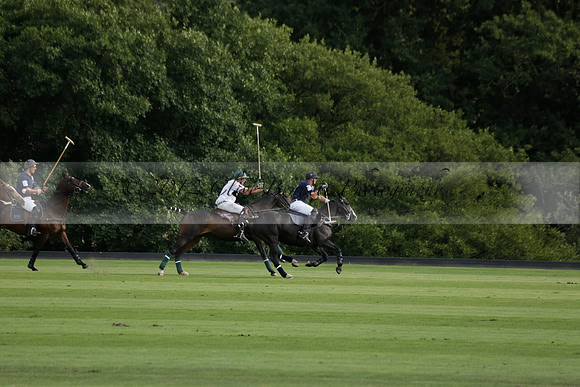 Pandas (white) v Home Farm (navy) in a Park House West Sussex Cup Polo match on Brooksfield at Cowdray Park Polo Club on Friday 30 August 2013. 2013.08.30 www.polopictures.co.uk