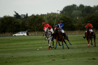 Ghost Chilli (blue) v Team Tonic (red) in a Lodsworth Cup Polo match on Ambersham 3 at Cowdray Park Polo Club on Friday 30 August 2013. 2013.08.30 www.polopictures.co.uk