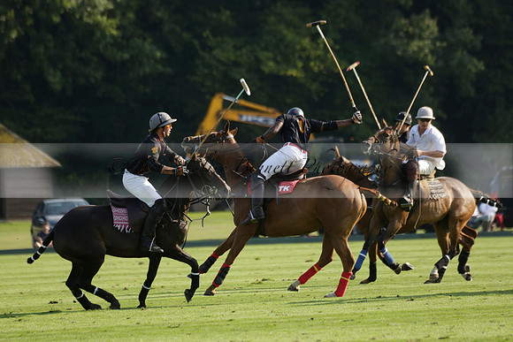 Pluma Negra (white) v Shoreline (black) in the Brecknock Cup Subsidiary final polo match played on Sunday 25 August 2013 at Cowdray Park Polo Club on Ambersham 1. 2013.10.12 www.polopictures.co.uk