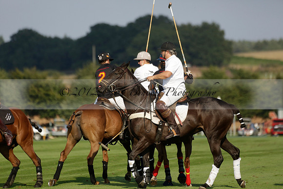 Pluma Negra (white) v Shoreline (black) in the Brecknock Cup Subsidiary final polo match played on Sunday 25 August 2013 at Cowdray Park Polo Club on Ambersham 1. 2013.10.12 www.polopictures.co.uk