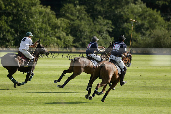 Pandas (white) v Home Farm (navy) in a Park House West Sussex Cup Polo match on Brooksfield at Cowdray Park Polo Club on Friday 30 August 2013. 2013.08.30 www.polopictures.co.uk